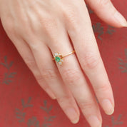 Bague style marguerite émeraude diamants