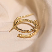 Créoles motif feuillage style vintage or 18 carats